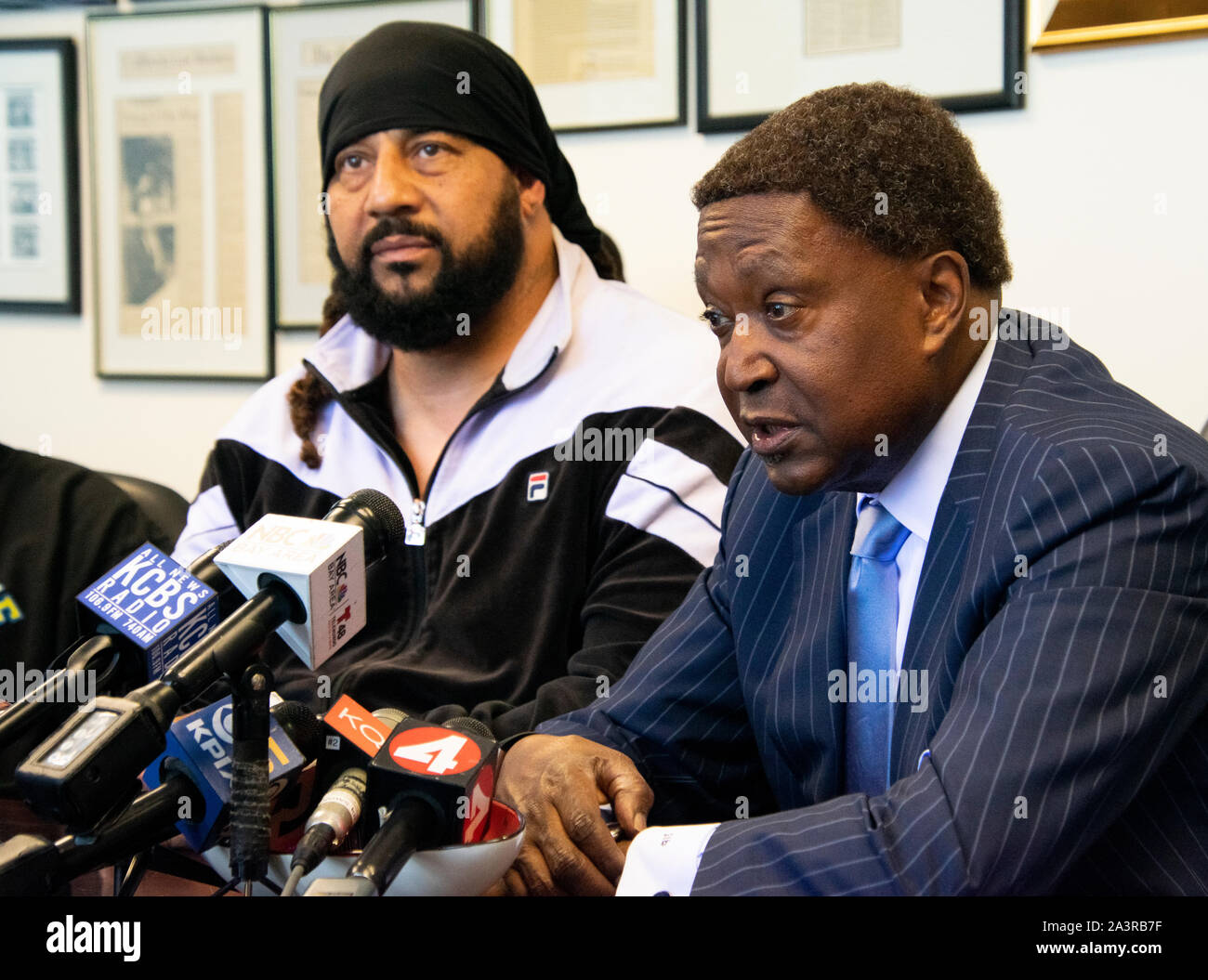 Attorney John Burris speaks alongside David Harrison to announce a lawsuit  for the fatal shooting of Harrison’s cousin Willie McCoy. Stock Photo
