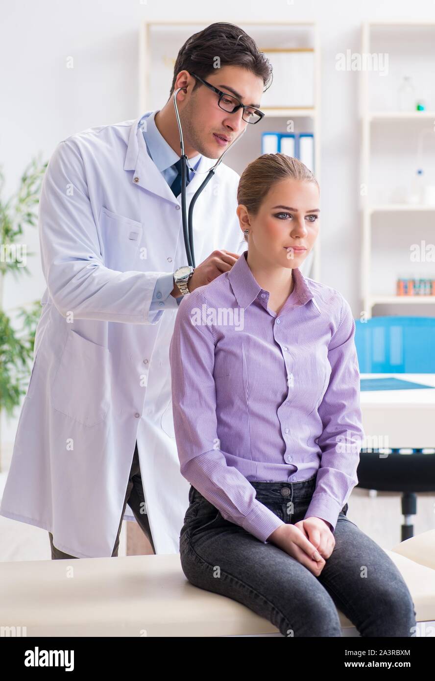 Patient visiting doctor for medical check-up in hospital Stock Photo