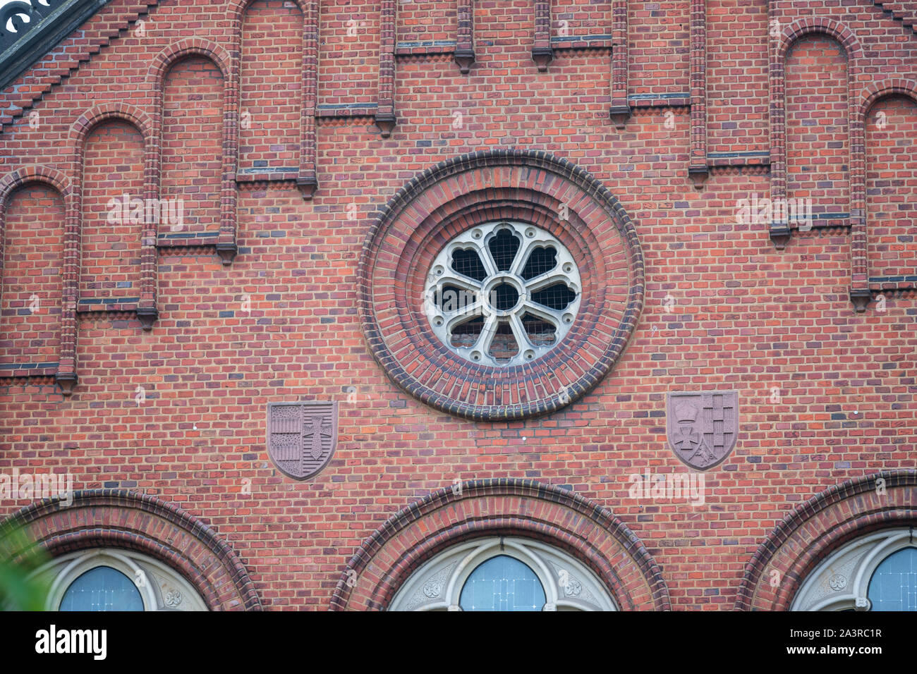 an old seti red facade with beautiful patterned glass windows Stock Photo