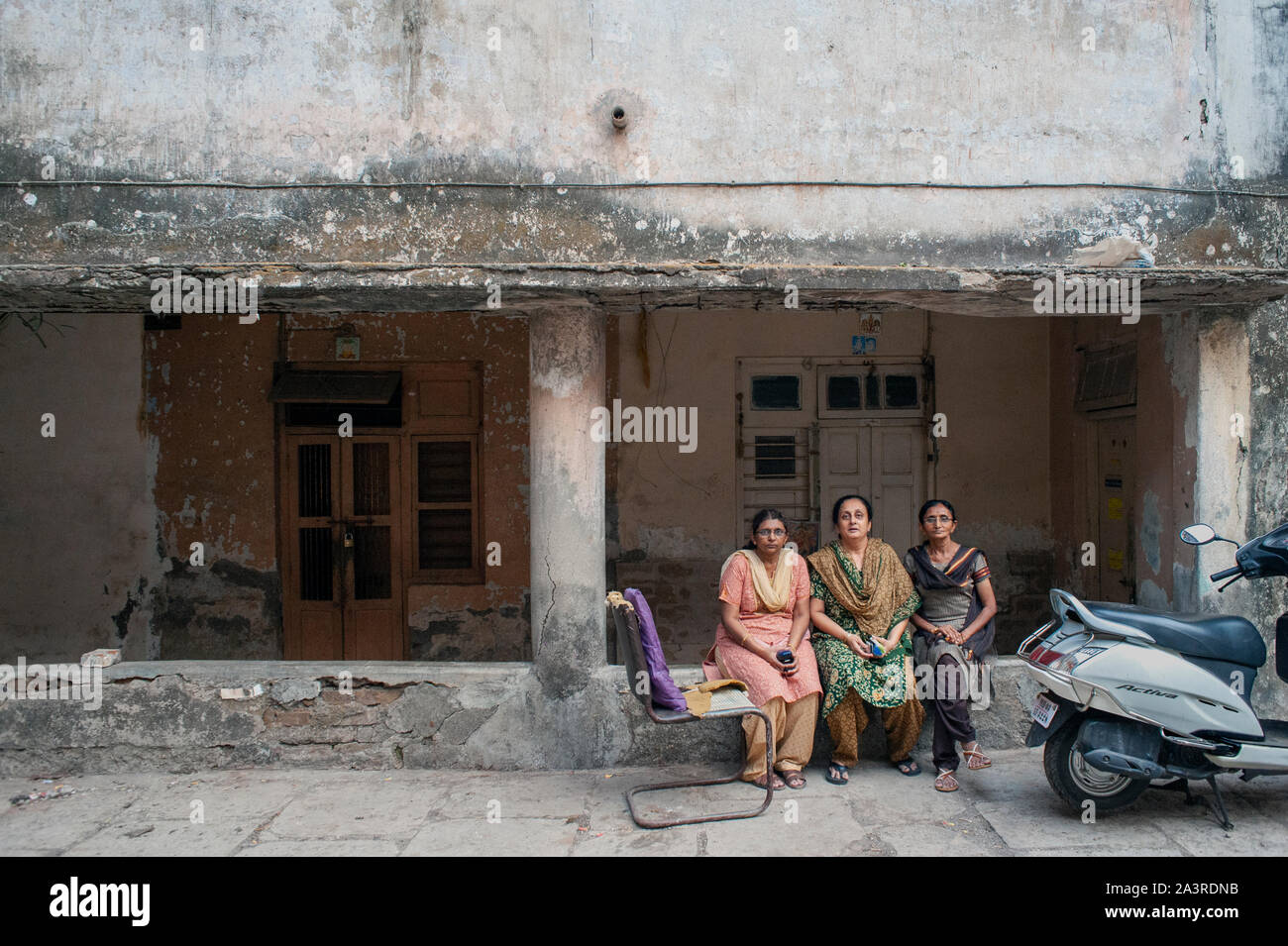 16 Apr 2016 Three lady posing outside their house old rundown three story building in mumbai about to demolished for reDevelopment Ghatkoper mumbai ma Stock Photo