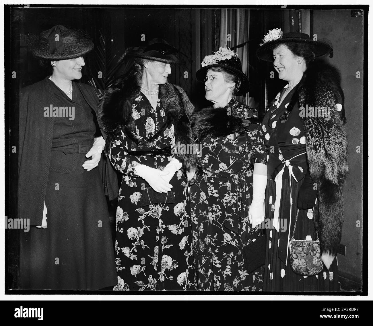 Supreme Court Justices' wives attend breakfast in honor of First Lady. Washington, D.C., April 25. Wives of the Chief Justices and the Associate Justices of the Supreme Court turned out on force today to attend the breakfast tendered in honor of Mrs. Roosevelt by the Congessional Club at the Mayflower Hotel. In the photograph, left to right: Mrs. Stanley F. Reed, Mrs. Charles Evans Hughes, Mrs. Harlan Fiske Stone, and Mrs. Owen J, Roberts, 4/25/38 Stock Photo