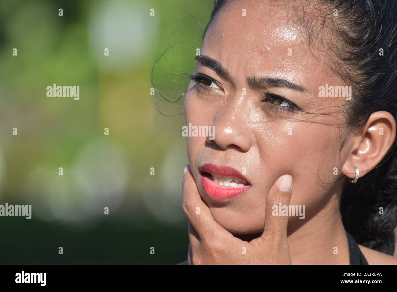 An Asian Woman Wondering Stock Photo