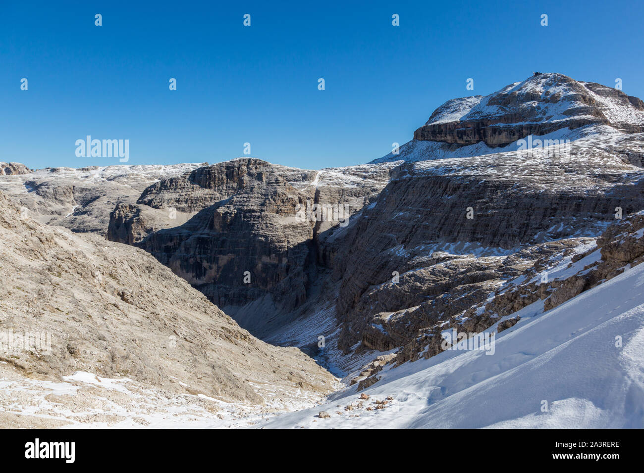 snowcapped Piz Boe mountain in UNESCO world heritage Dolomites, blue sky Stock Photo