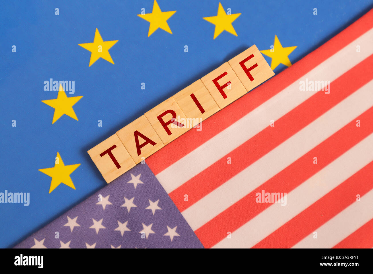 Concept of Bilateral relations and US tariff on EU showing with flags. Stock Photo