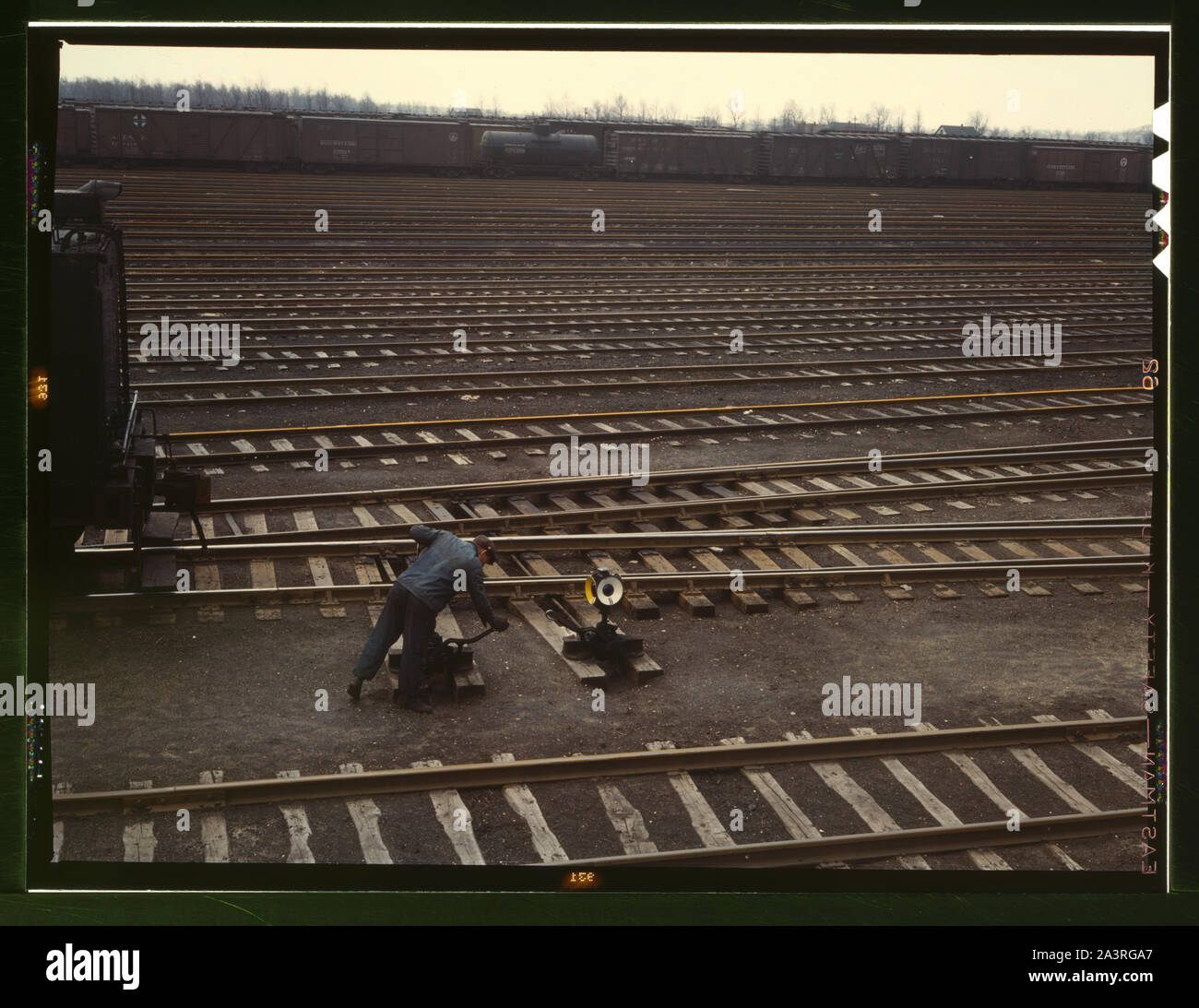 Switchman throwing a switch at C & NW RR's [i.e. Chicago and North