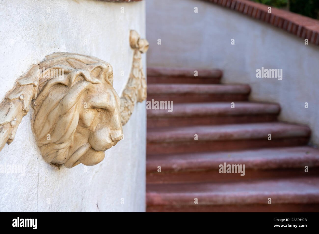 Lion head statue at the enter of a luxury home Stock Photo Alamy