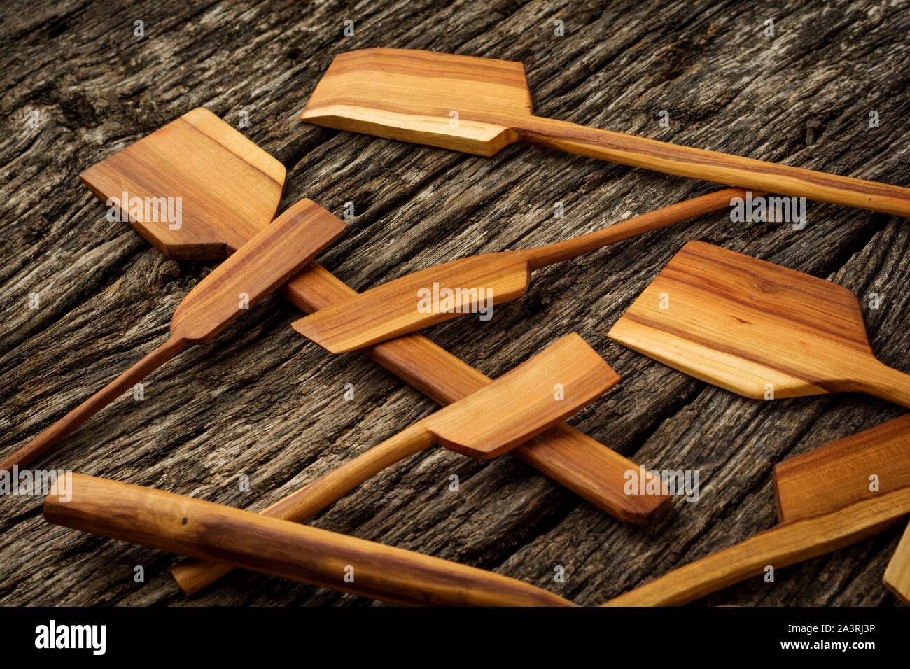Wooden kitchen utensils on rustic background close-up. Flat lay. Stock Photo