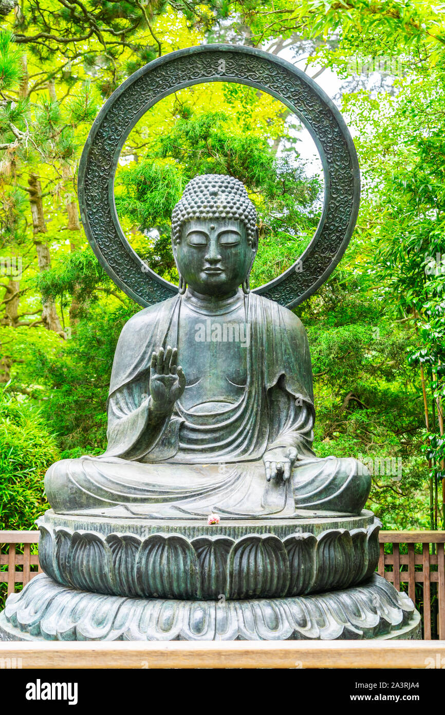Seated Bronze Buddha on Lotus at San Francisco Japanese Garden Stock Photo