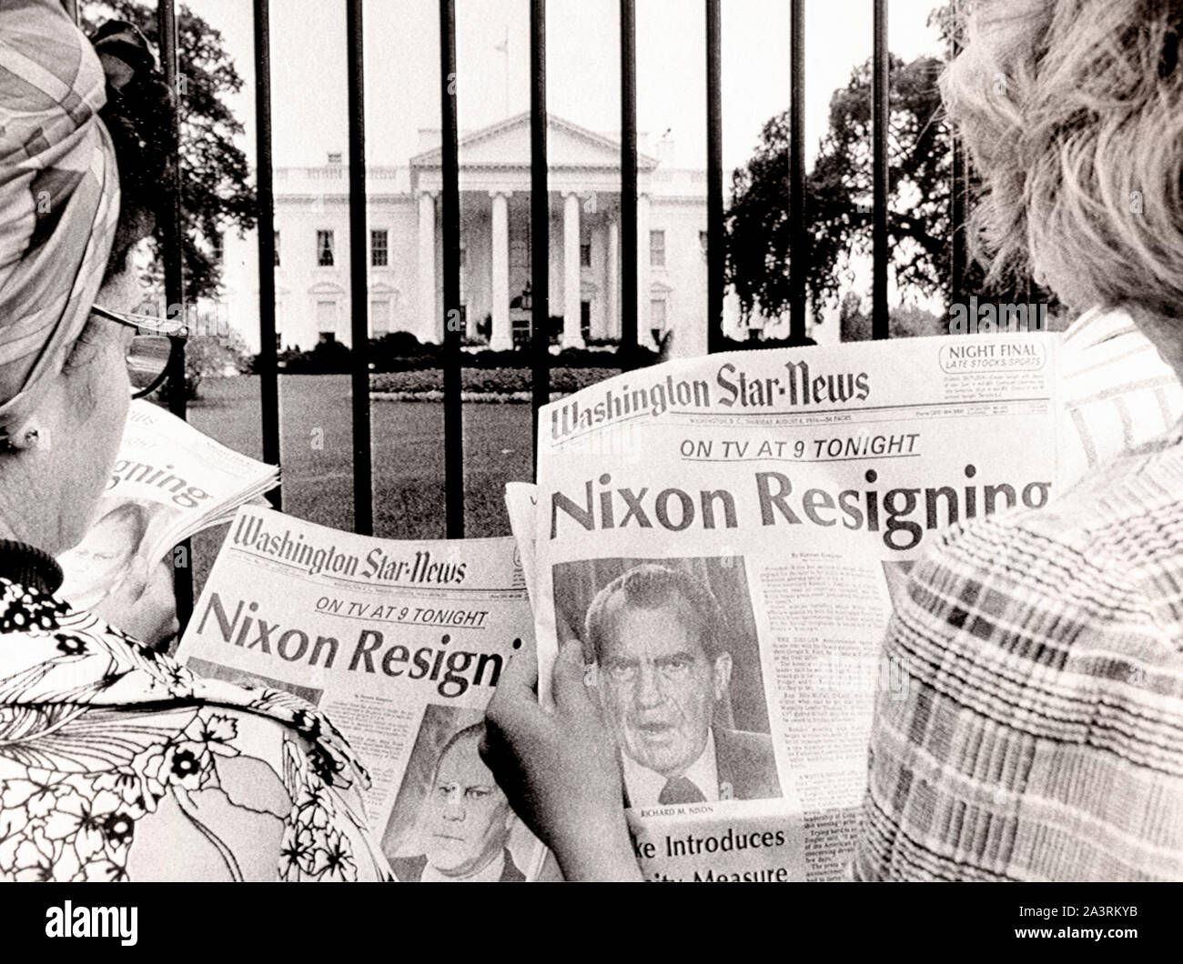 People is reading newspaper's headlines in front of the White House, where is said, that President Nixon will become the first President of the countr Stock Photo