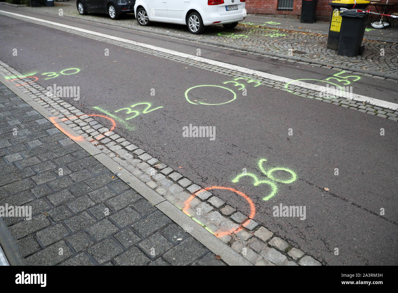 Halle, Germany. 10th Oct, 2019. Police markings can be seen on the street in front of a kebab shop. During attacks in the middle of Halle an der Saale in Saxony-Anhalt yesterday two people were shot dead in front of a synagogue and in a kebab snack bar. Credit: dpa picture alliance/Alamy Live News Stock Photo