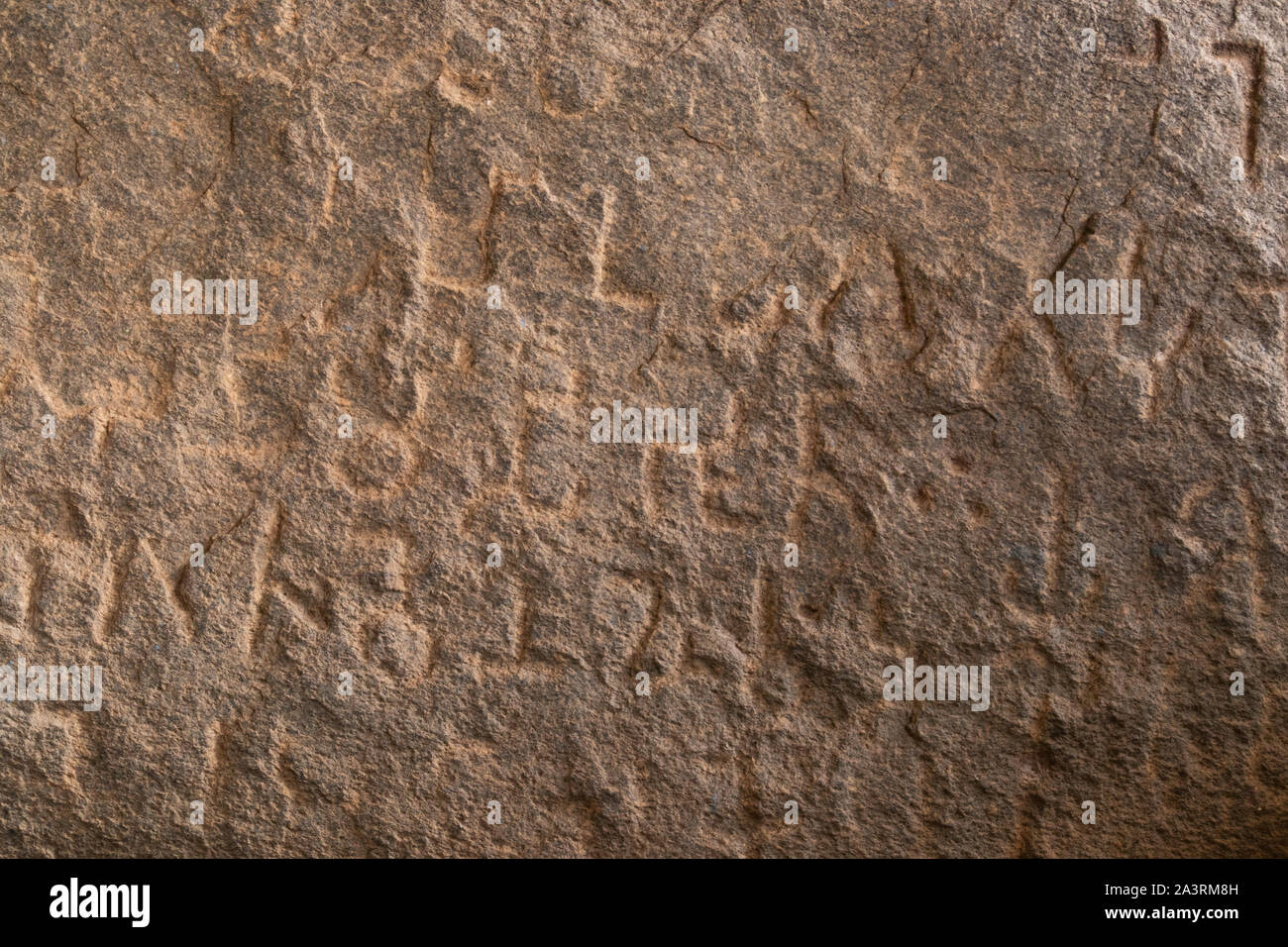 Close up of Inscriptions of Emperor Ashoka on rock boulder at Maski, Raichur, India. Stock Photo