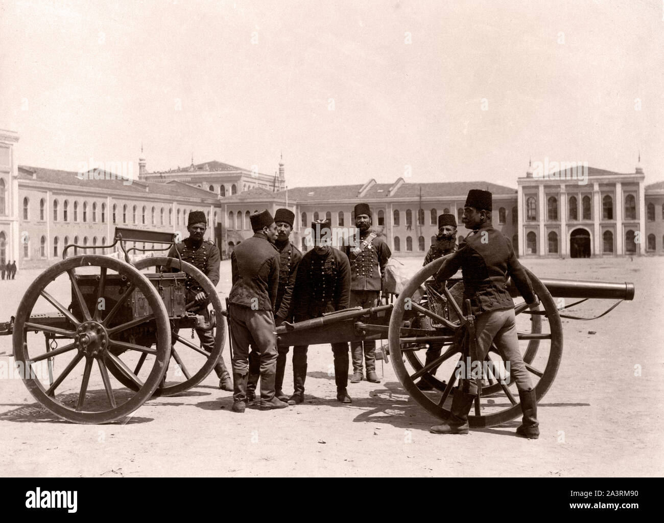 Turkish horse artillery in front of barracks. Horse artillery was a type of light, fast-moving, and fast-firing artillery which provided highly mobile Stock Photo