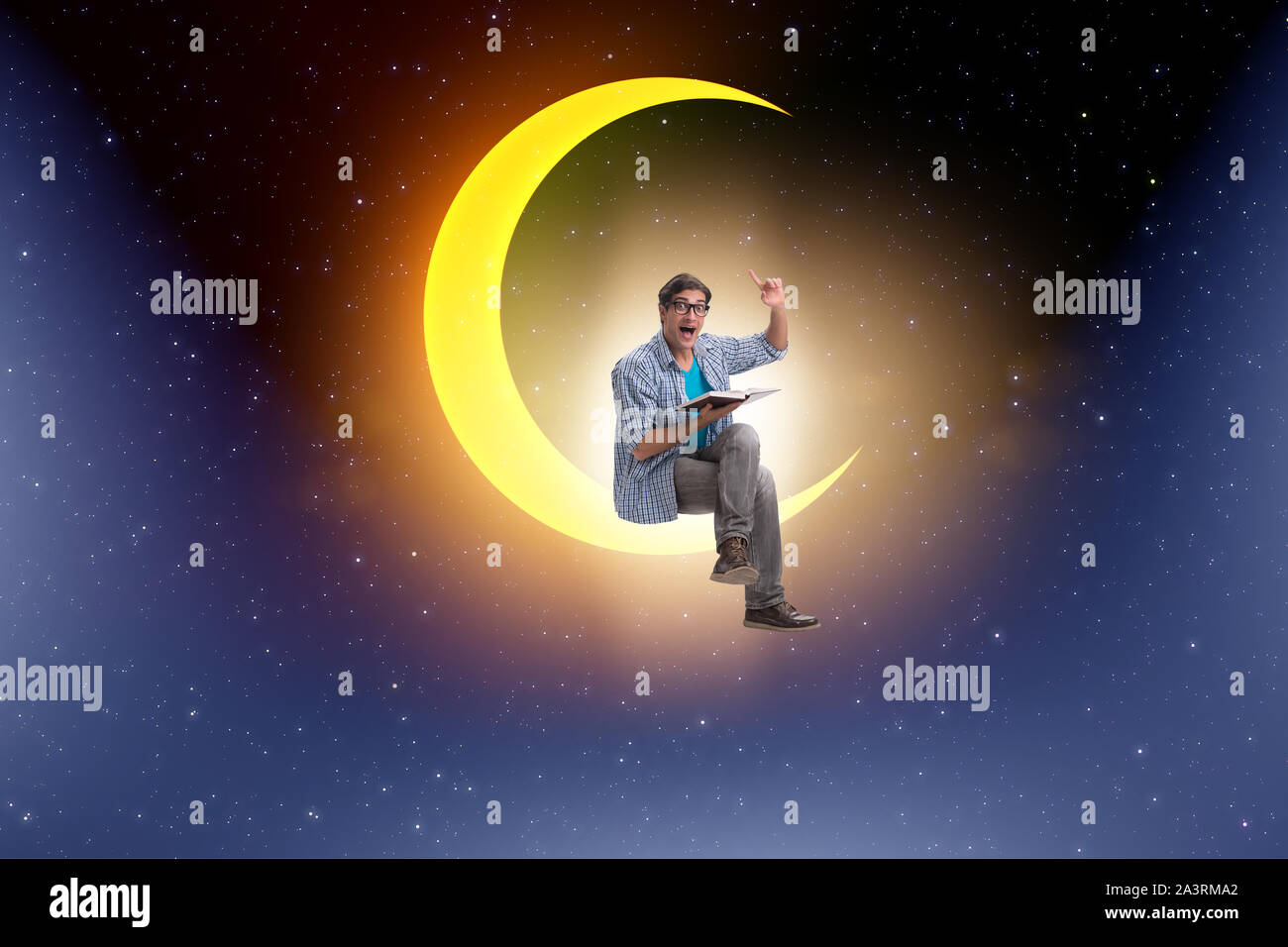 The student reading book on the moon crescent Stock Photo