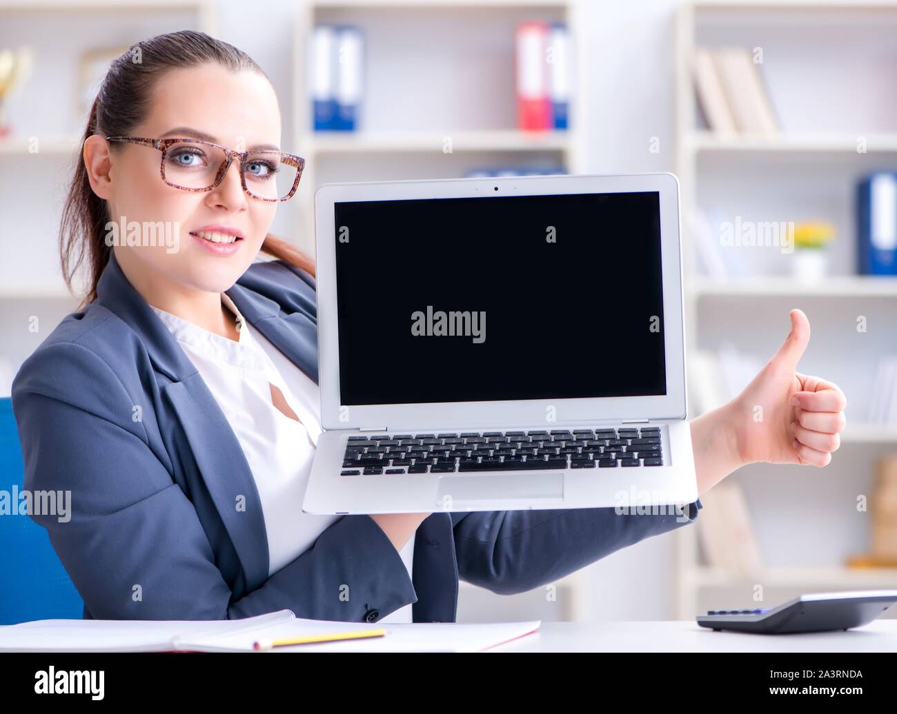 The businesswoman working in the office at desk Stock Photo - Alamy