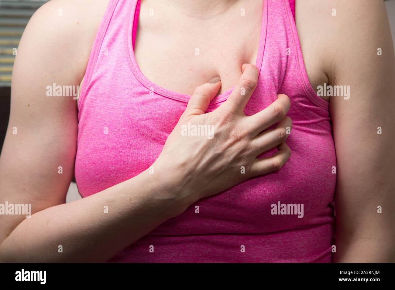 Woman having a heart attack Stock Photo