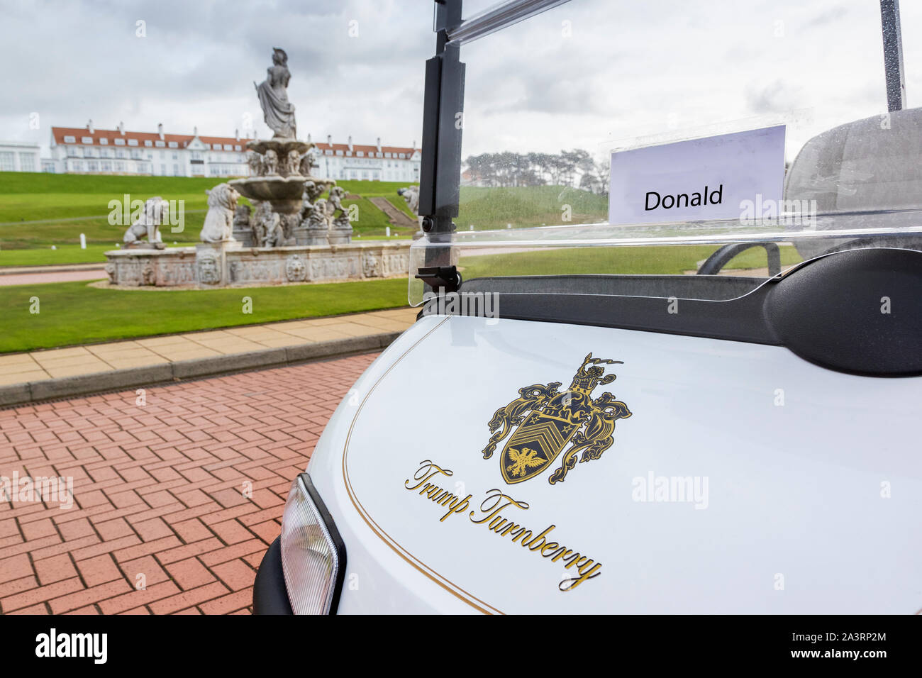 Trump Turnberry embossed golf buggy parked outside the clubhouse at Trump Turnberry Hotel and golf resort, Turnberry, Ayrshire, Scotland, UK Stock Photo