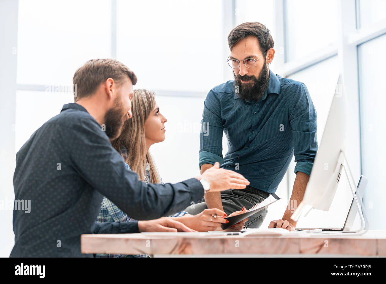 colleagues extending their hands to each other for a handshake Stock Photo