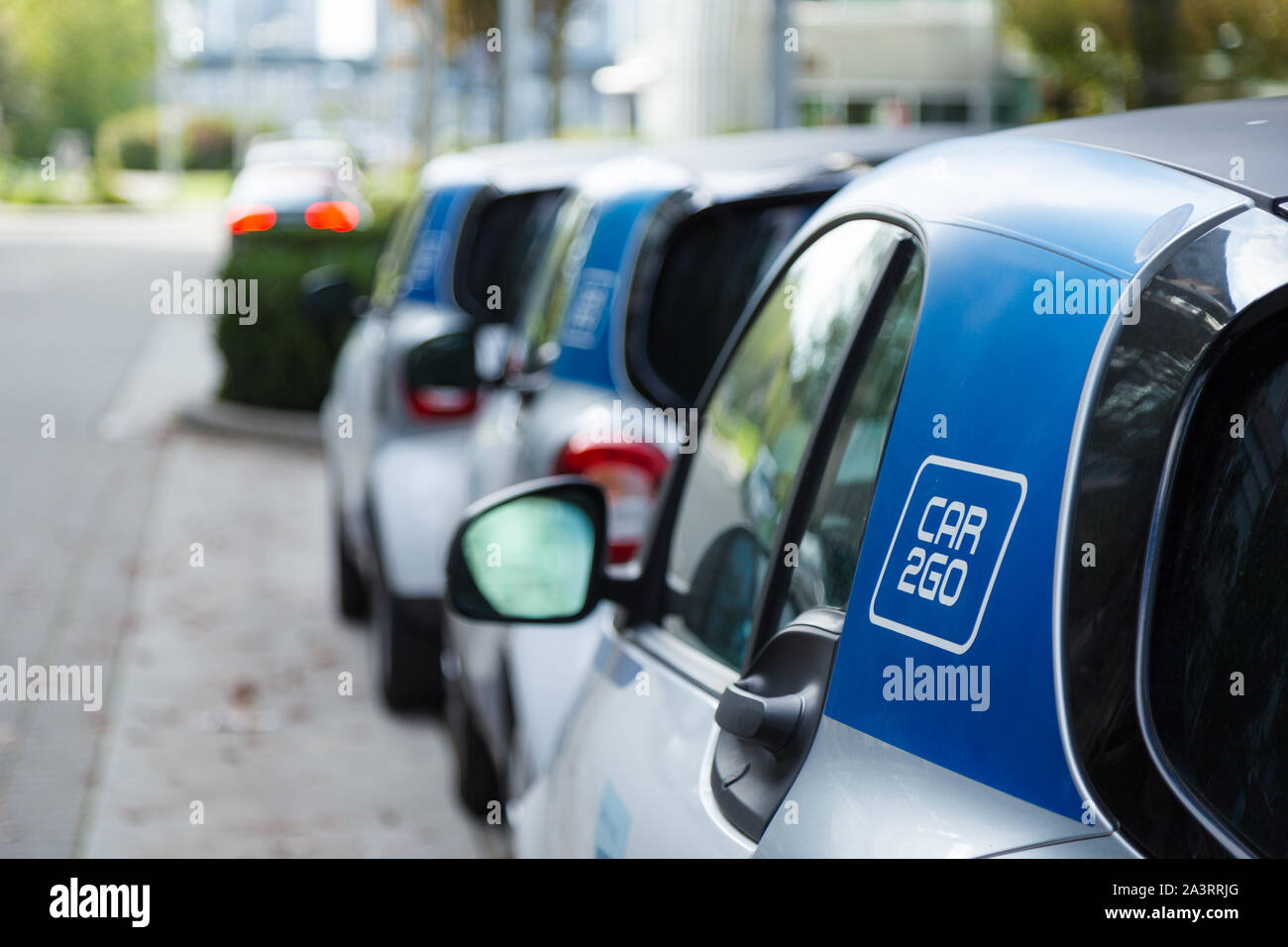 VANCOUVER, BC, CANADA - SEPT 21, 2019: A row of Car2Go SmartCars in Vancouver's Olympic Village which make up part of Vancouver's ridesharing car Stock Photo