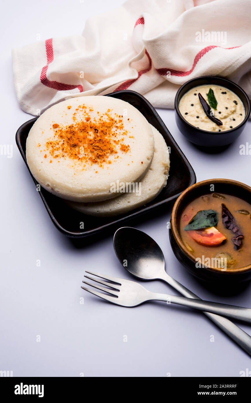 Thatte or Taste Idli also known as Plate Idly is a Popular south Indian Food, served with sambar and chutney. Stock Photo