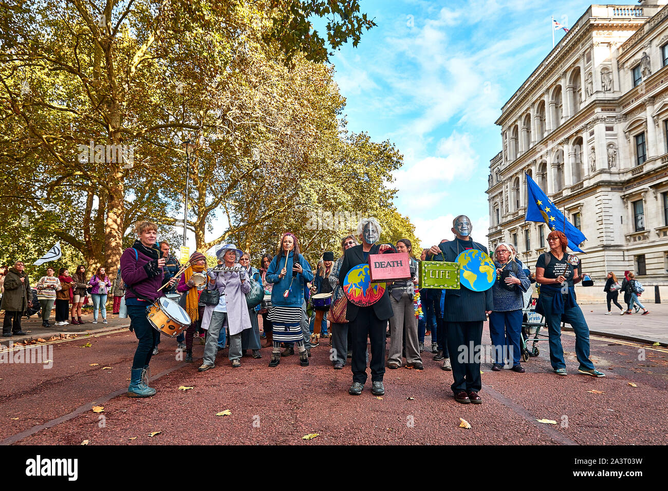 London, U.K. - Oct 9, 2019: Environmental campaigners from Extinction Rebellion marching along Horse Guards Road on the third day of a planned two weeks of protests. Stock Photo