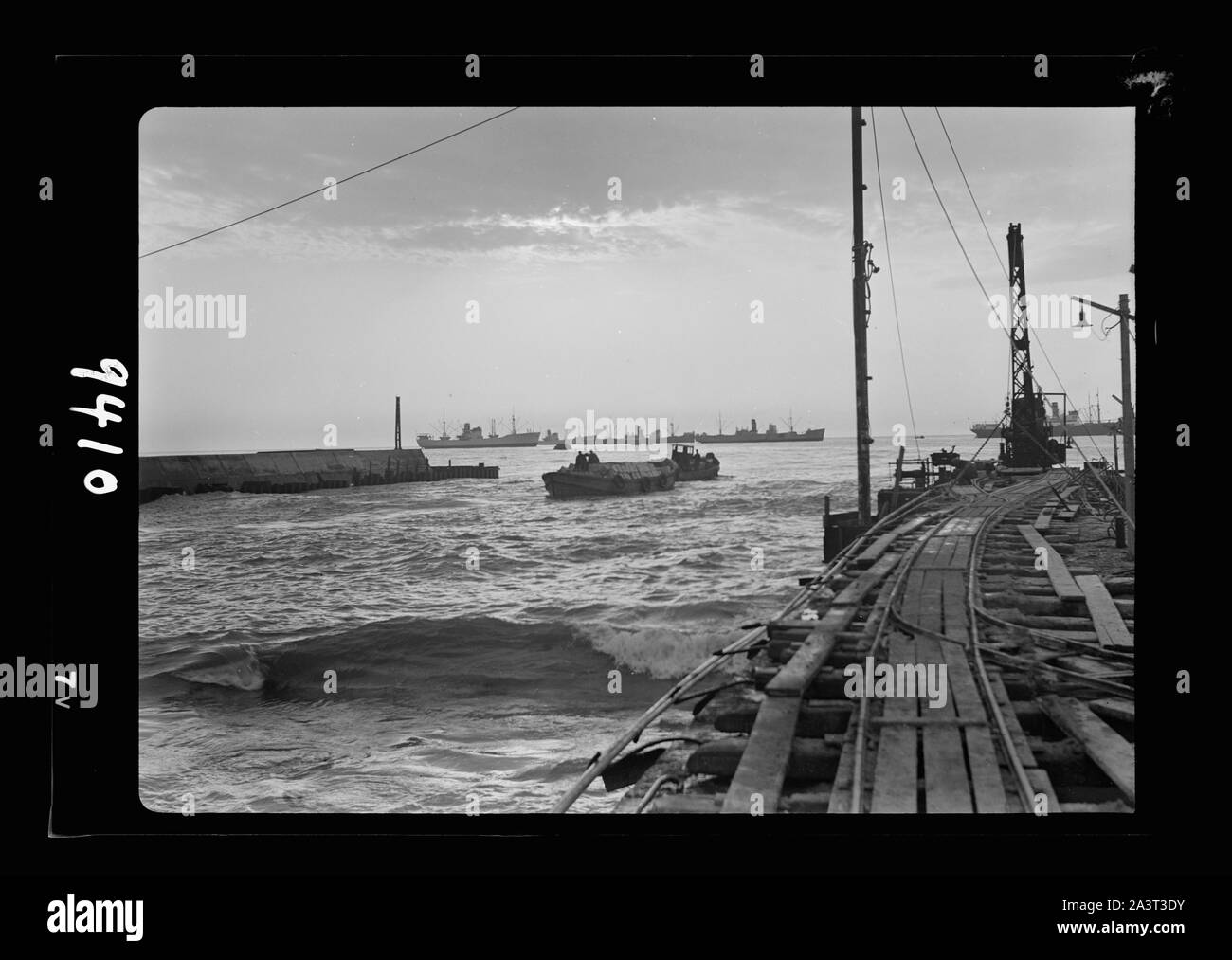 Tel Aviv Harbour. Setting sun, looking across lighter basin Stock Photo