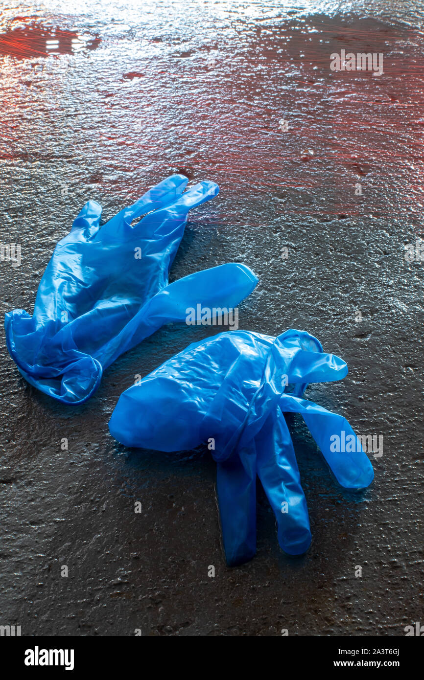 blue latex gloves  on the floor Stock Photo