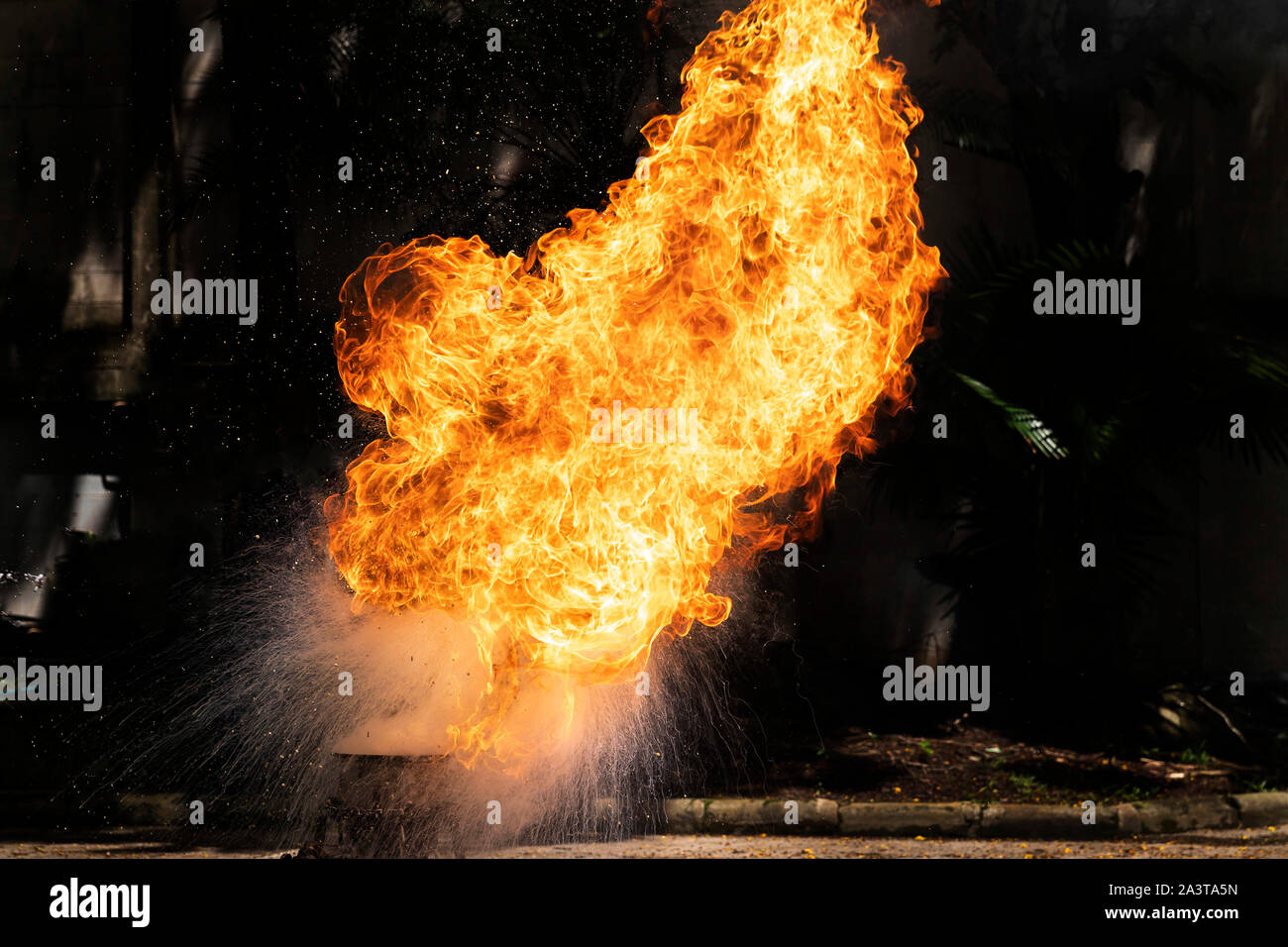 Flames caused by the explosion of the oil. Demonstration of water on