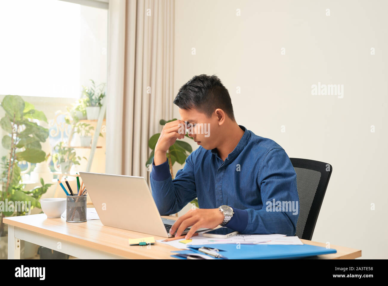 business, people and work concept - tired businessman in his office Stock Photo