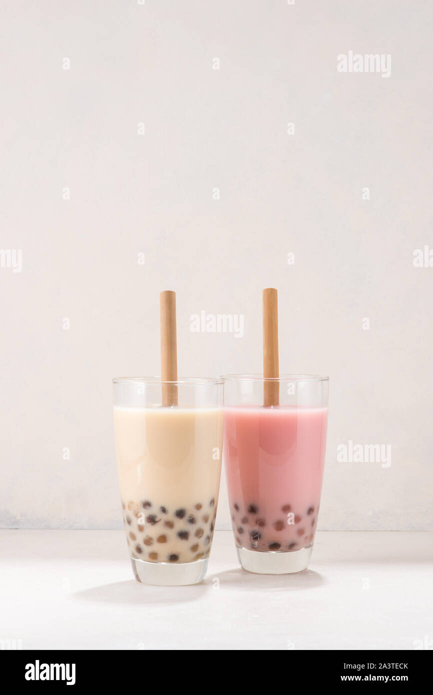 Variety of homemade bubble tea/ boba tea with tapioca pearls on white ...