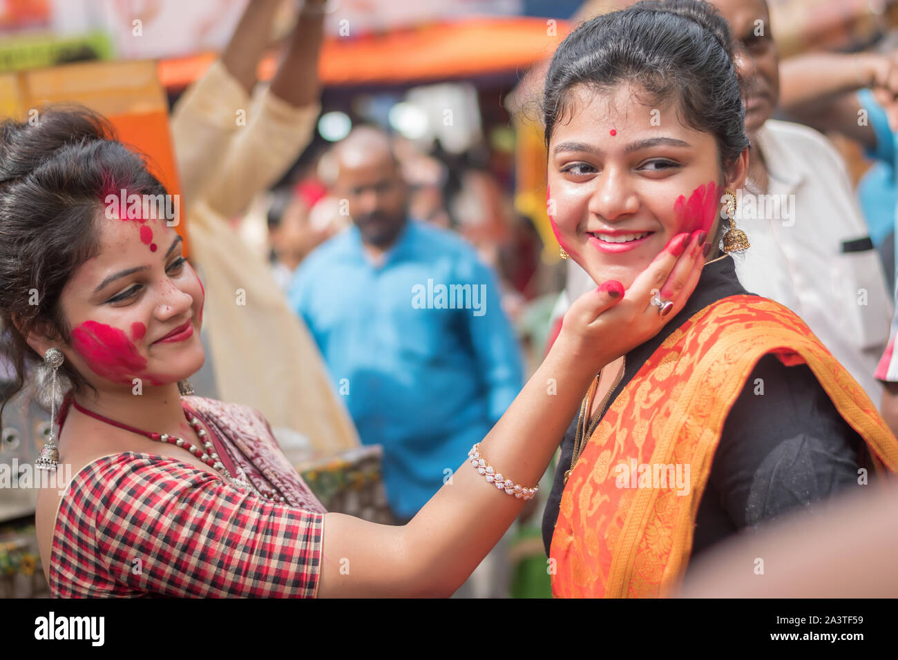 Kolkata, India – 8th October 2019; Women participate in Sindur Khela at a puja pandal on the last day of Durga puja at Baghbazar Sarbojanin in Kolkata Stock Photo