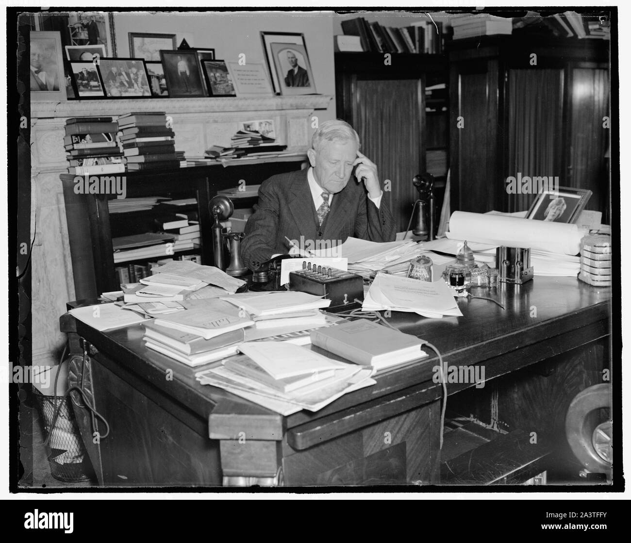 Texas senator. Washington, D.C., Nov. 4. The veteran U.S. Senator from Texas, Morris Sheppard is busily engaged these days preparing for the opening of the special session Congress on November 15. This picture was made at Senator's office today. 11/4/37 Stock Photo