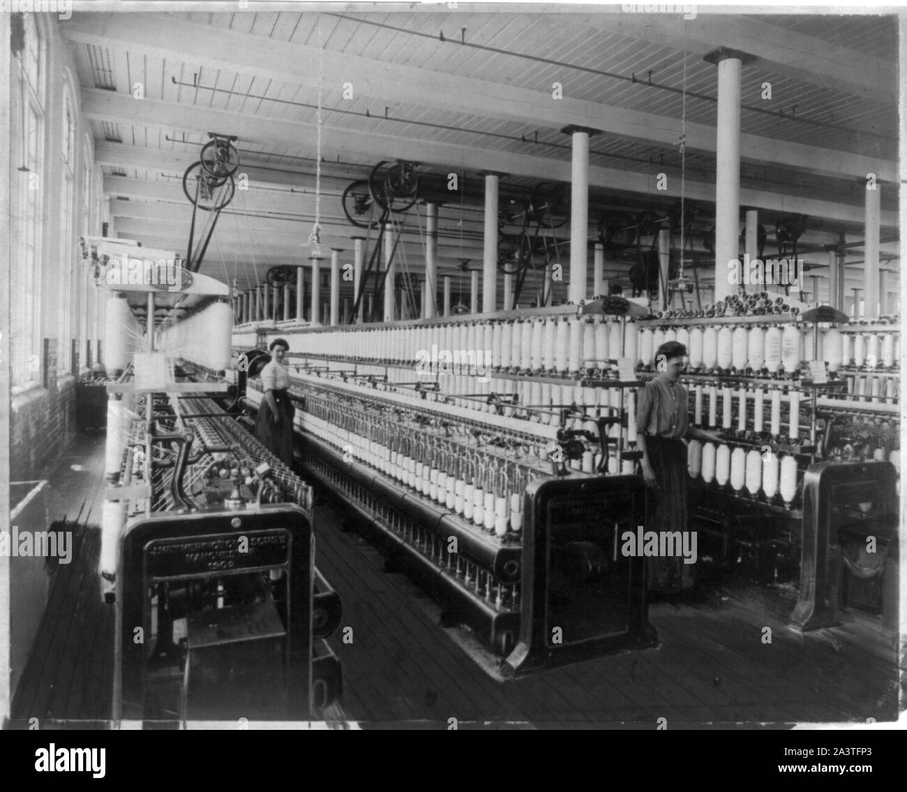 Textile factory with two women at machines Stock Photo Alamy