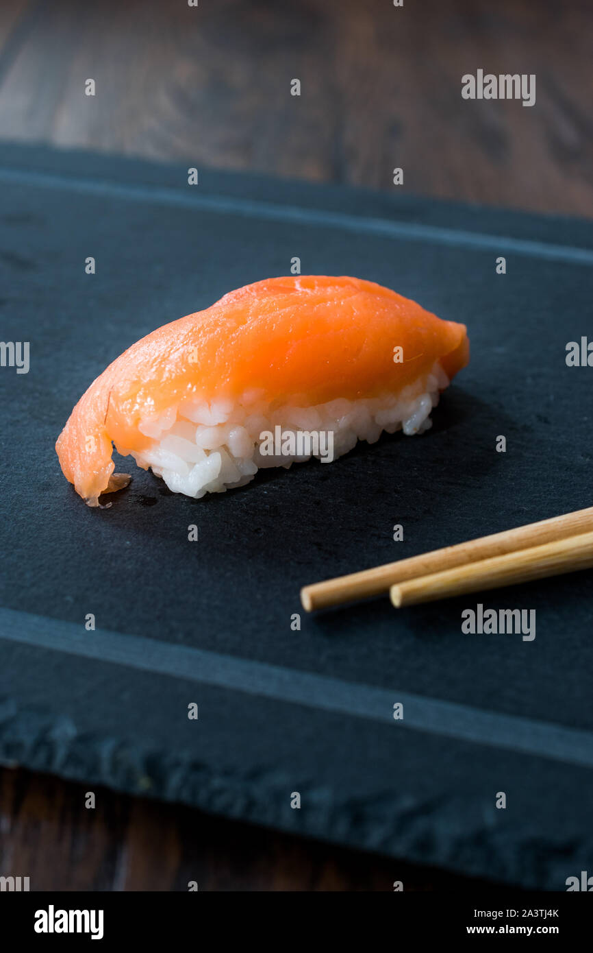 Sake Nigiri Sushi with Ginger, Wasabi, Soy Sauce and Chopsticks