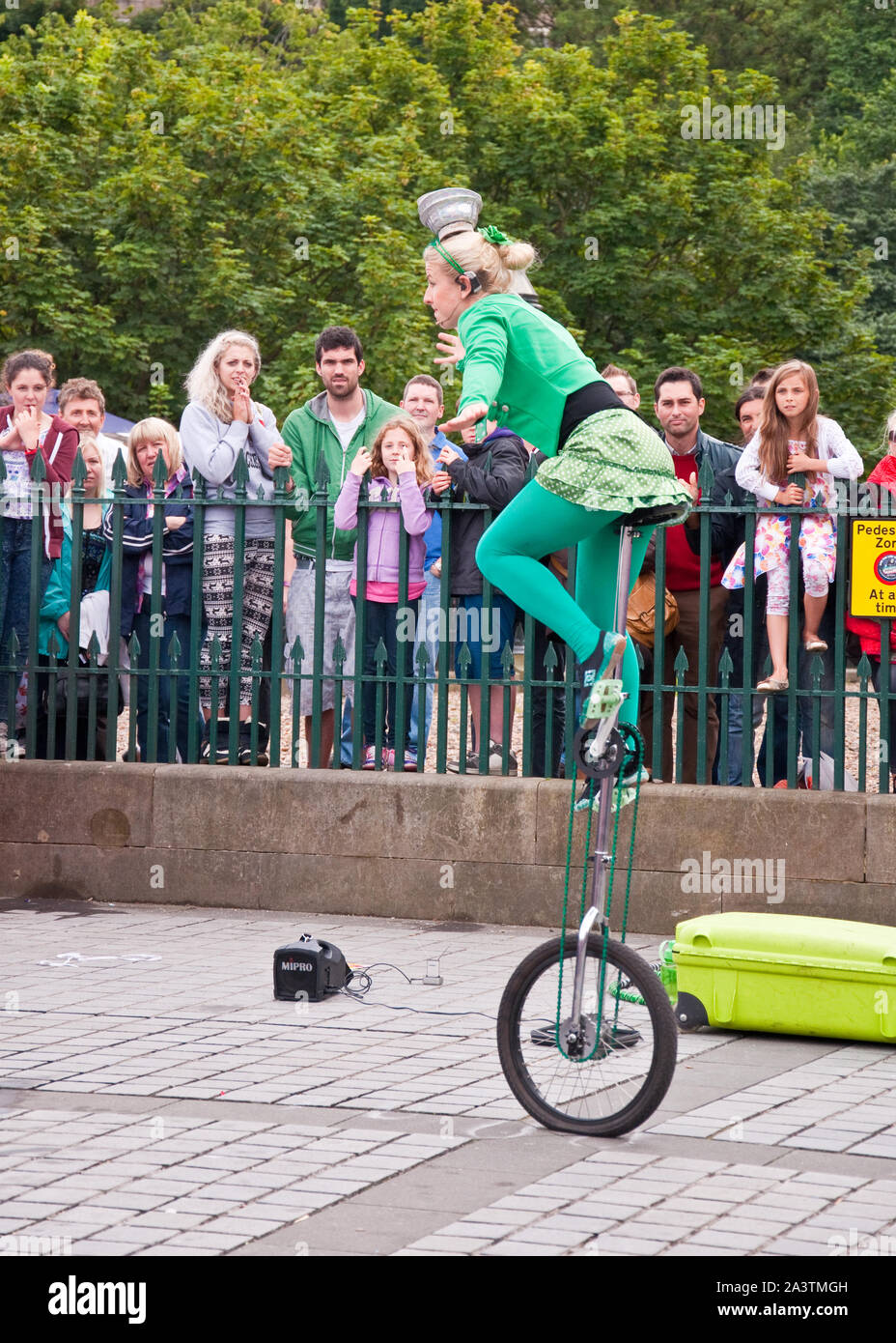 Street performer on unicycle. Edinburgh Fringe Festival. The Mound, Edinburgh, Scotland Stock Photo