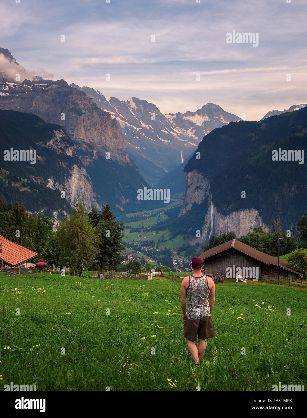 Tourist looks at the Lauterbrunnen valley from the village of Wengen, Switzerland Stock Photo