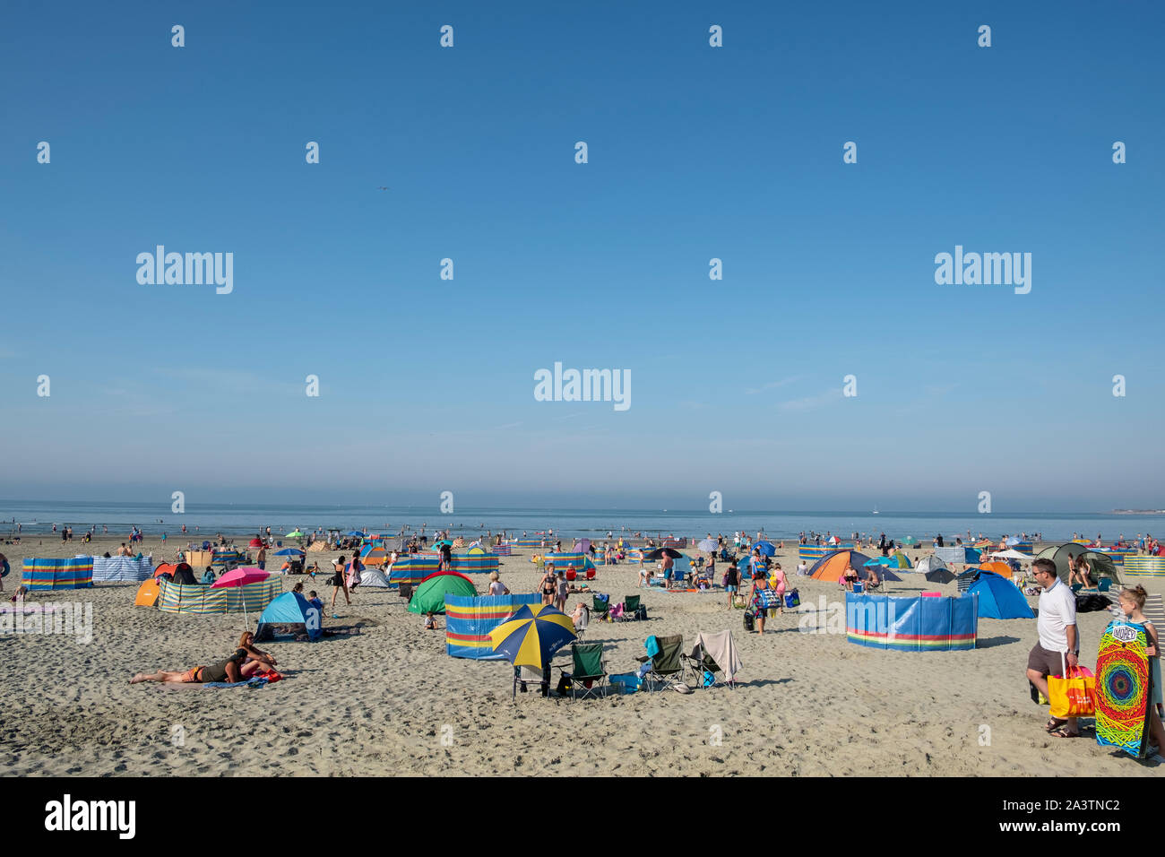 West Wittering beach on an August bank holiday weekend with holiday makers enjoying the sunshine and sand. Stock Photo