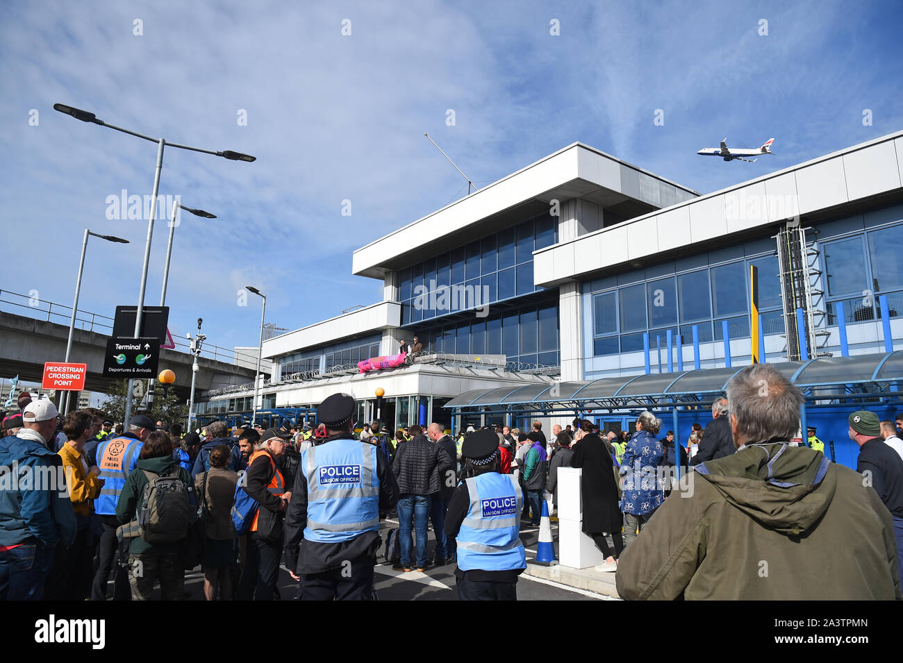 Protesters at City Airport, London, during an Extinction Rebellion climate change protest. Stock Photo