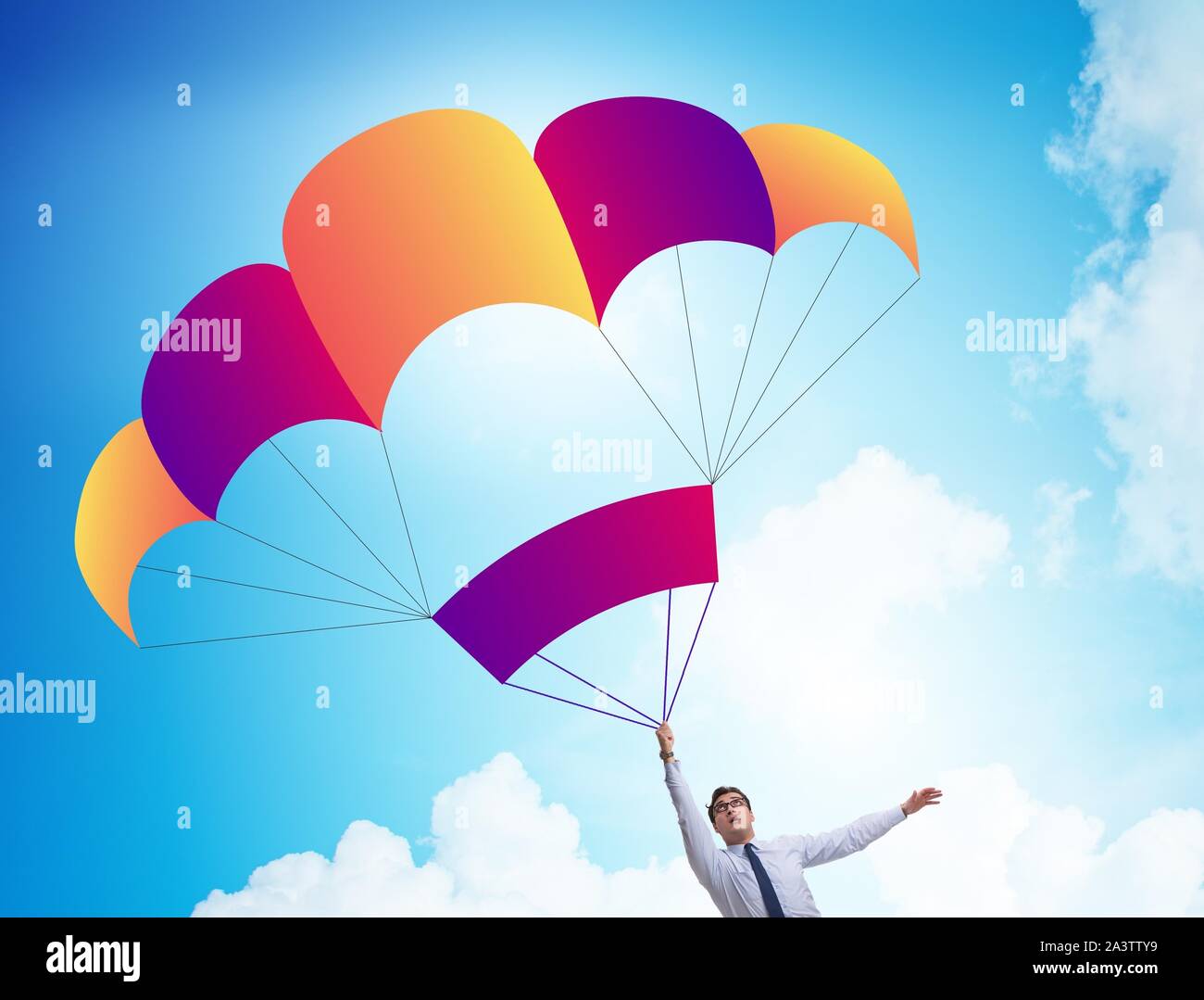 The young businessman falling on parachute in business concept Stock
