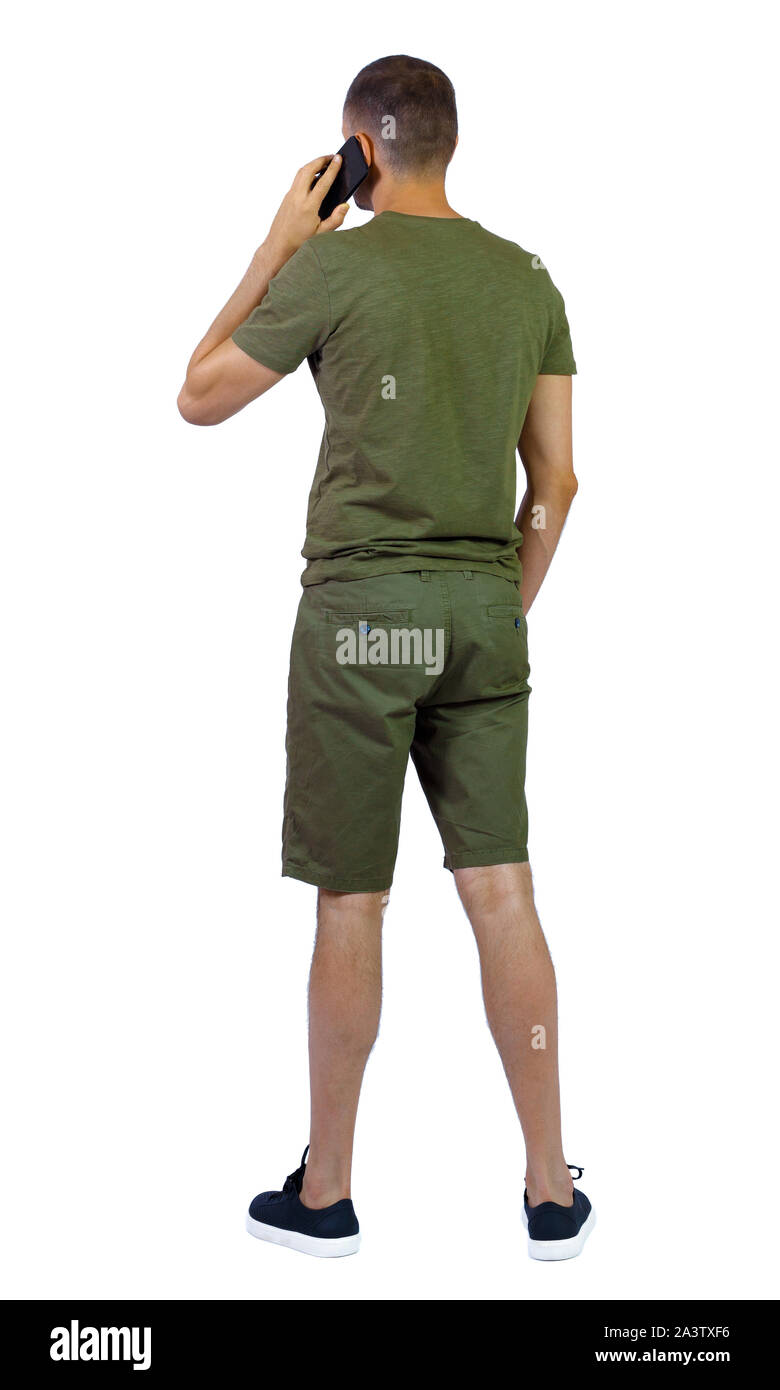 back view of a man talking on smartphone. backside view of person. Rear ...