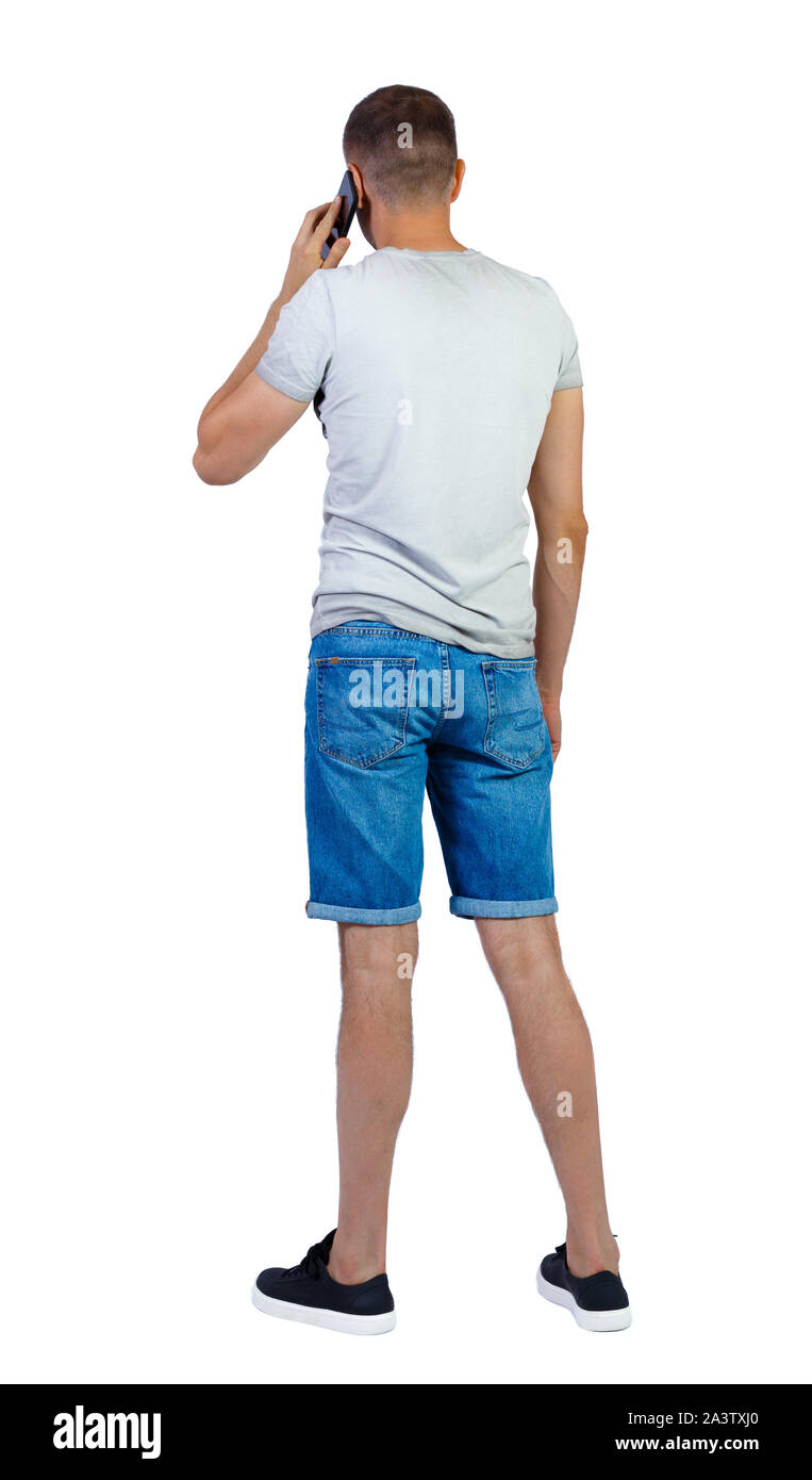 back view of a man talking on smartphone. backside view of person. Rear ...