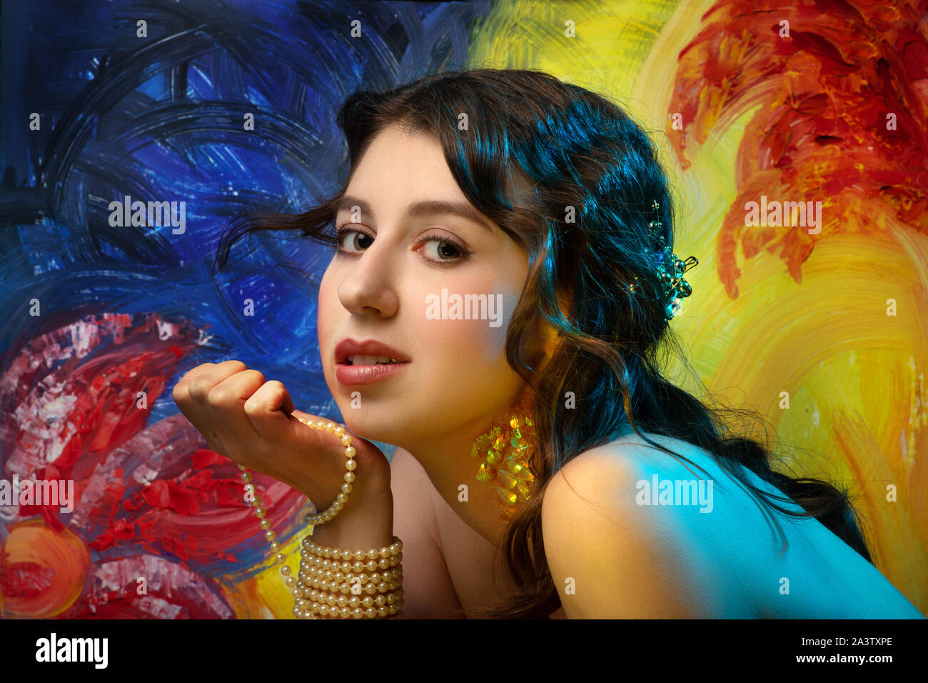 young woman with gypsy or mermaid makeup side view, looking at camera ...