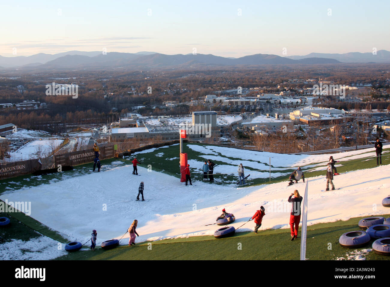 Inflatable snow tube hires stock photography and images Alamy