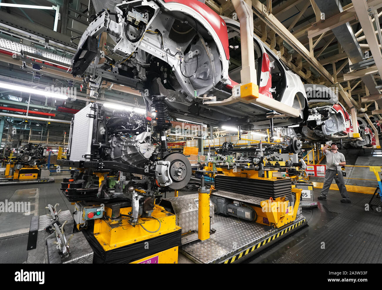 Workers on the production line at Nissan's factory in Sunderland after they were told that the car manufacturer is to end the night shift at its UK plant. Stock Photo