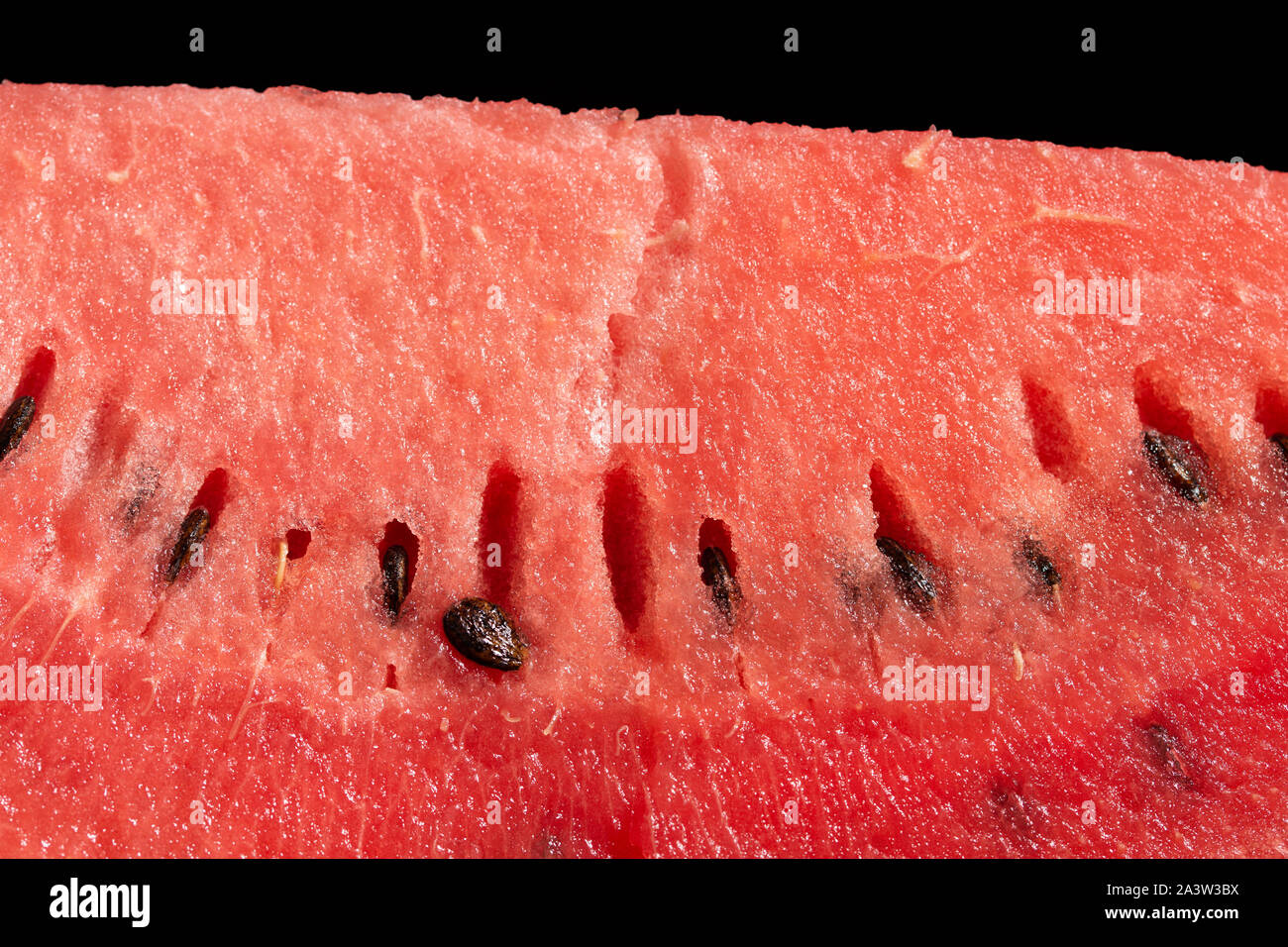 slice of watermelon on black background Stock Photo