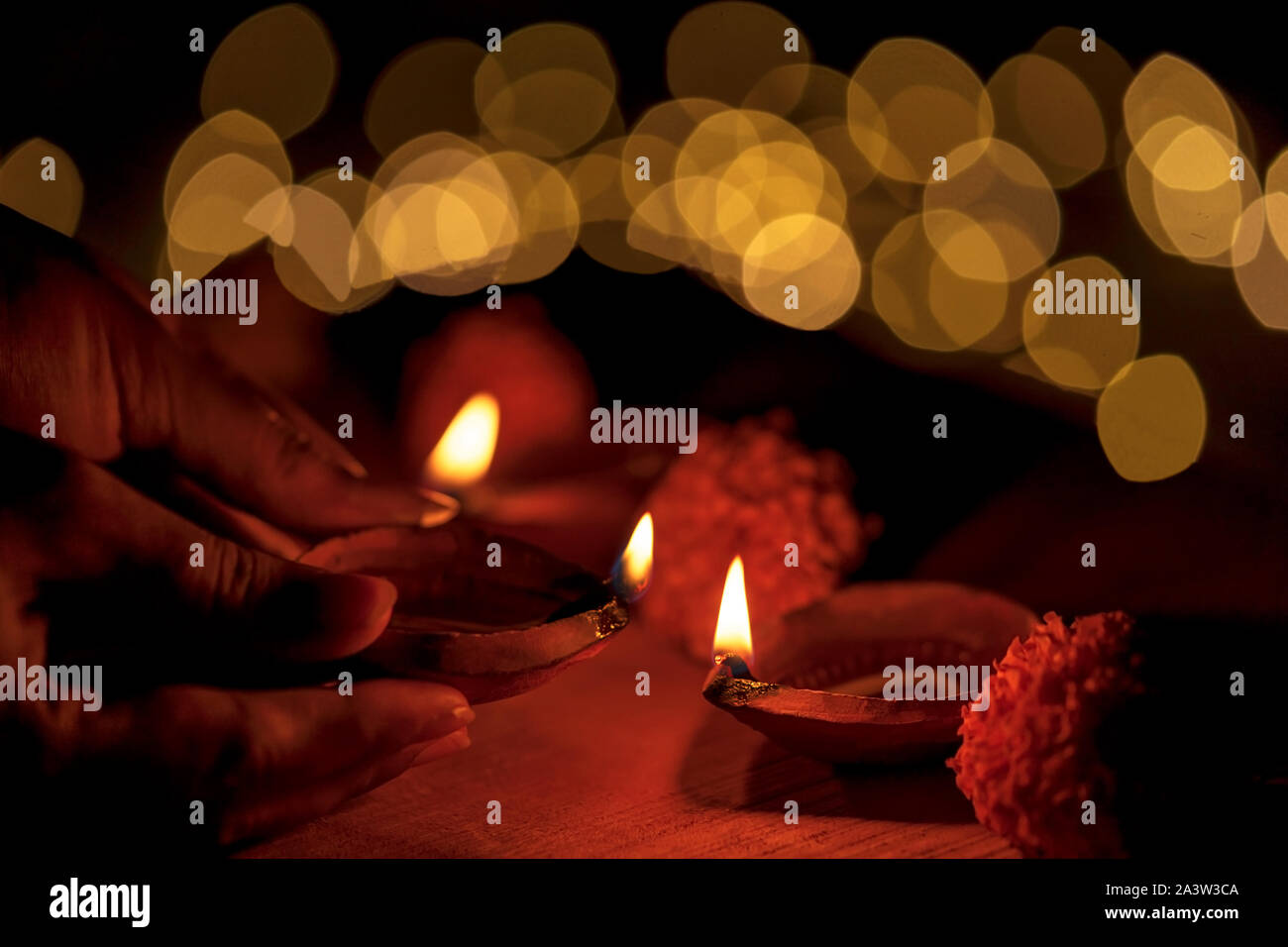 Indian woman lighting oil lamp hires stock photography and images Alamy