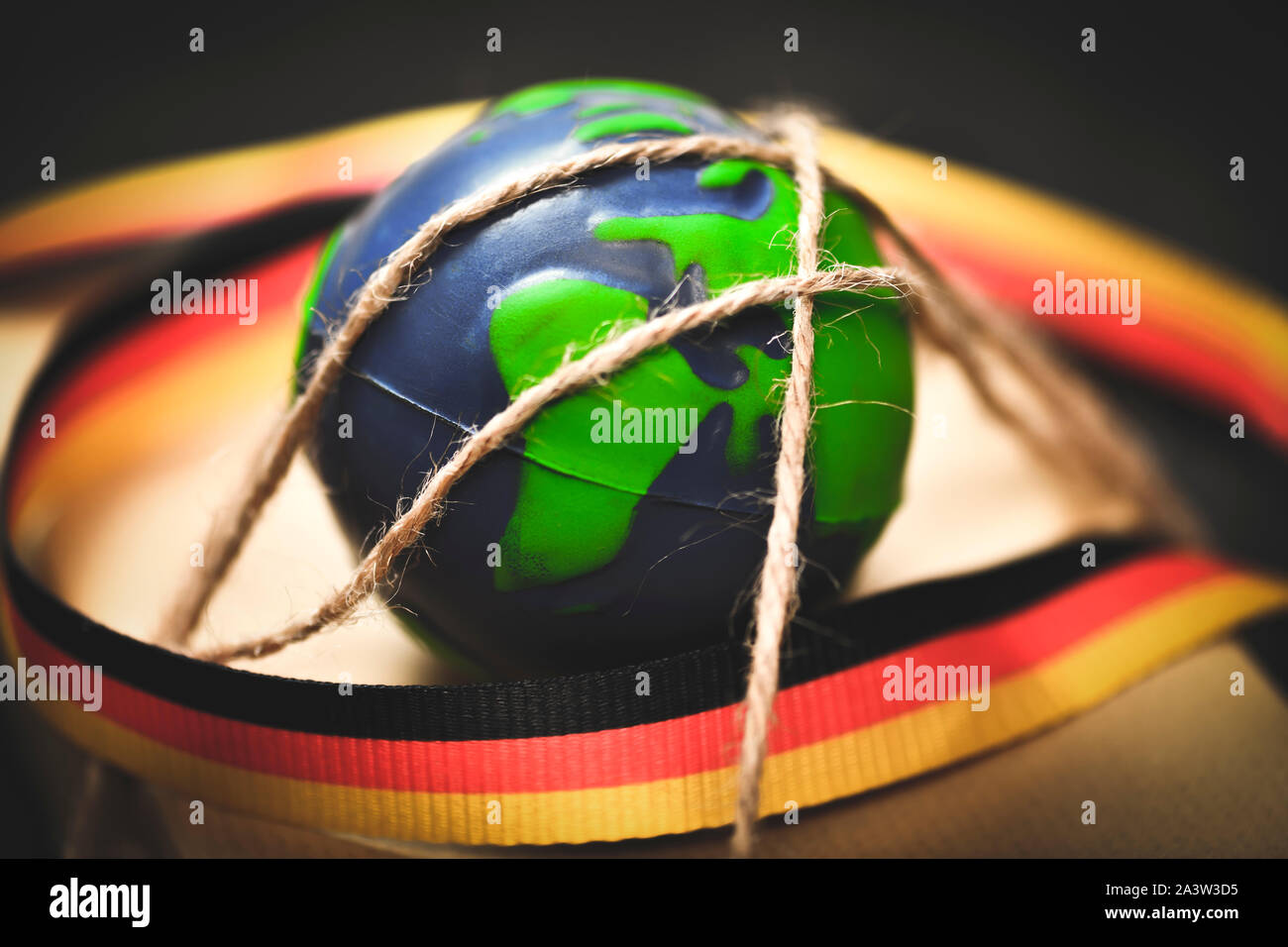 Earth, package and German flag, climate policy Stock Photo