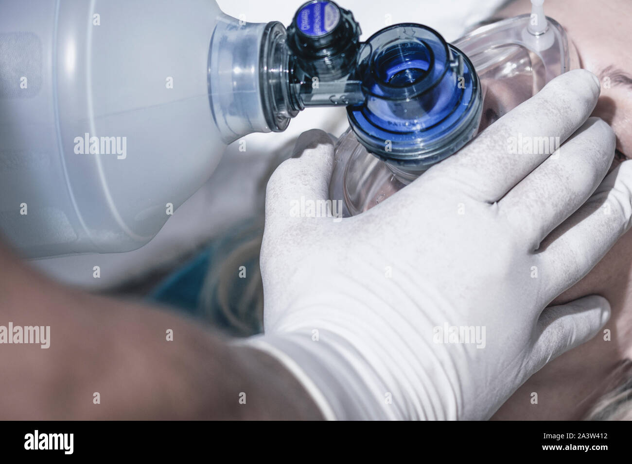 Doctor applying first aid measures using respiratory equipment, artificial lung ventilation, first aid measures Stock Photo