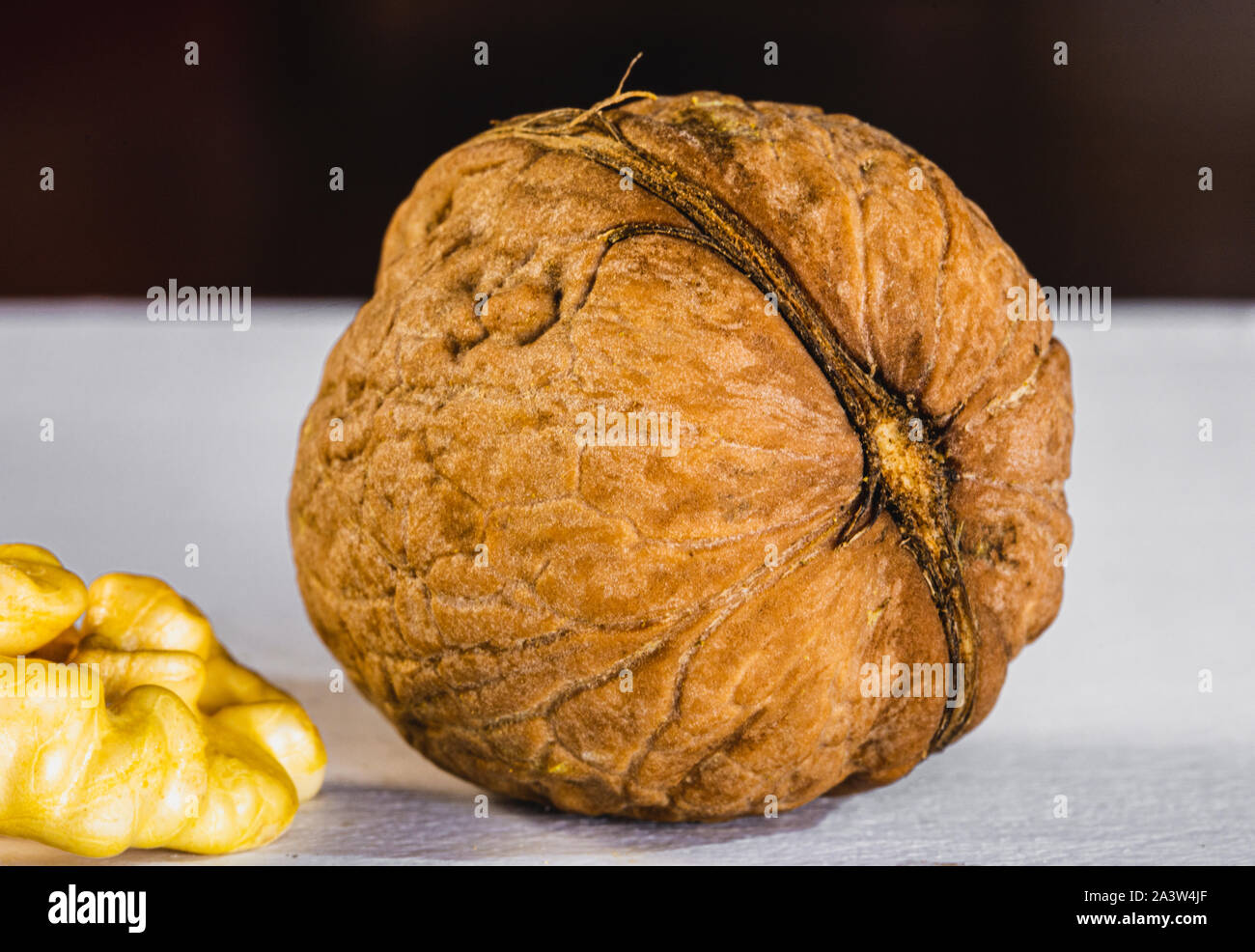 Walnuts on wooden background, nut in shell Stock Photo