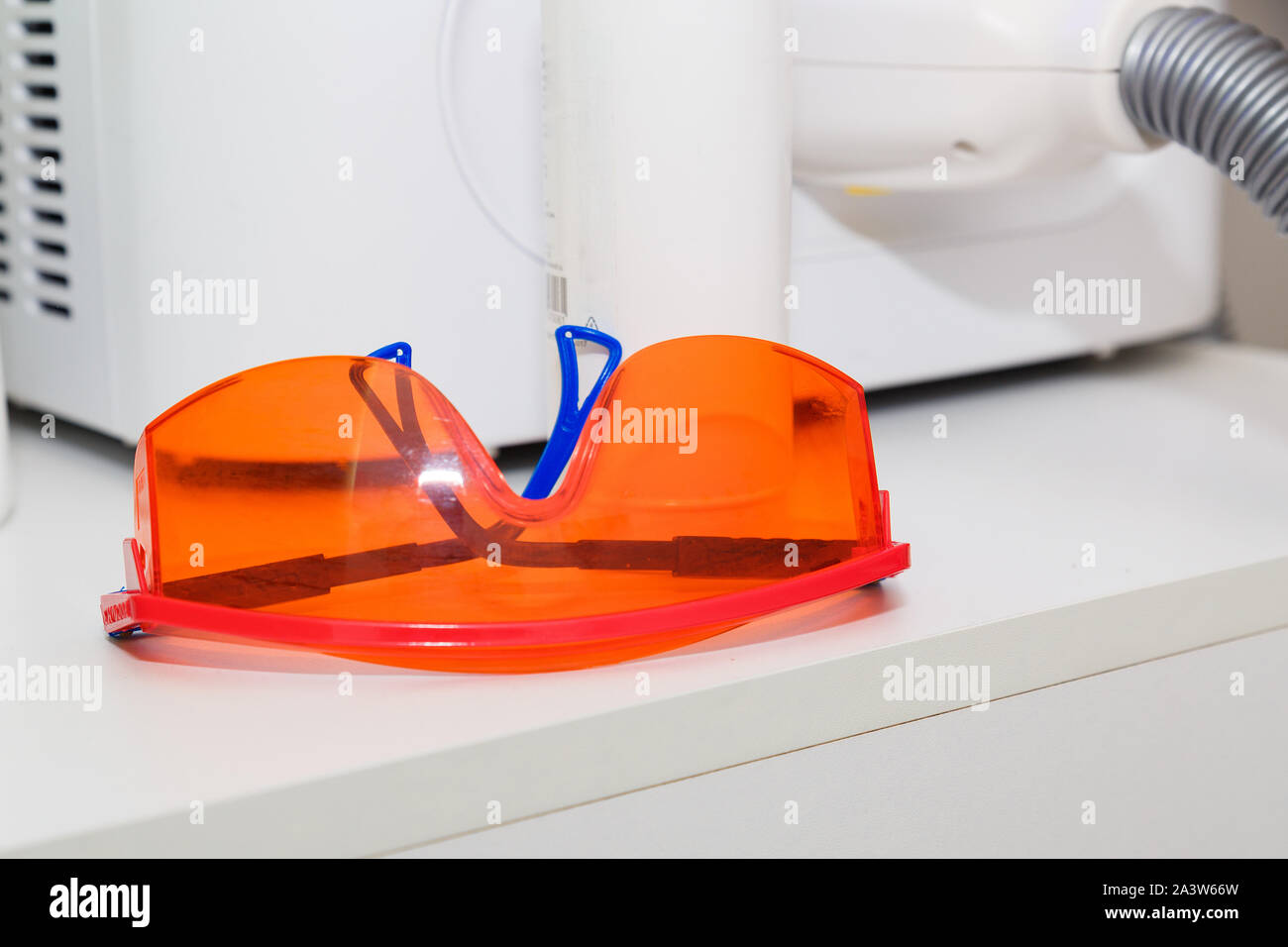 two pairs of safety glasses for laser hair removal Stock Photo Alamy