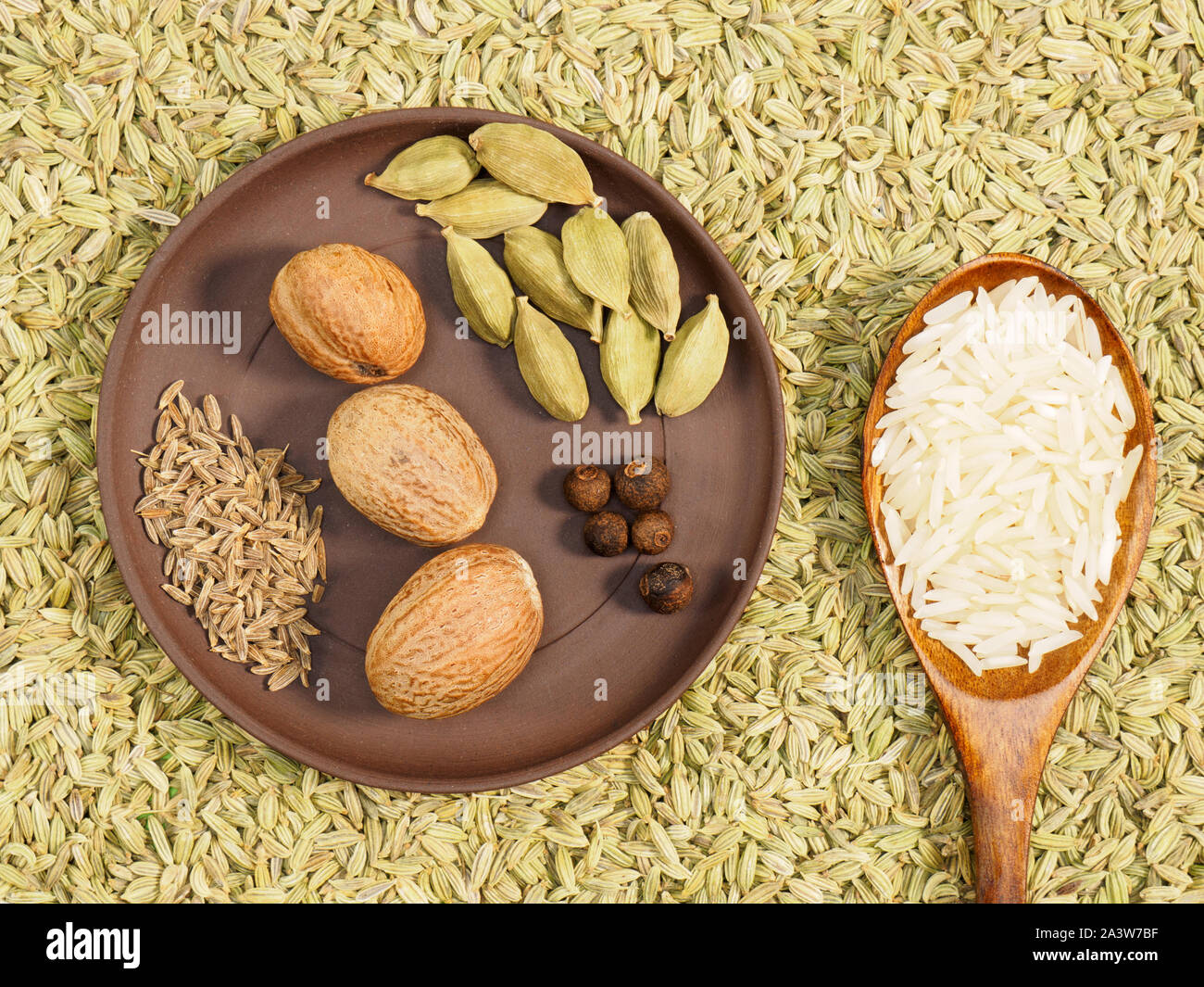 Basmati rice and spices allspice, cardamom, cumin, jeera, nutmeg in